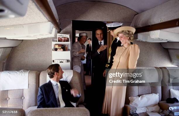 The Prince And Princess Of Wales On Board A Royal Flight To Australia, Laughing With Their Staff