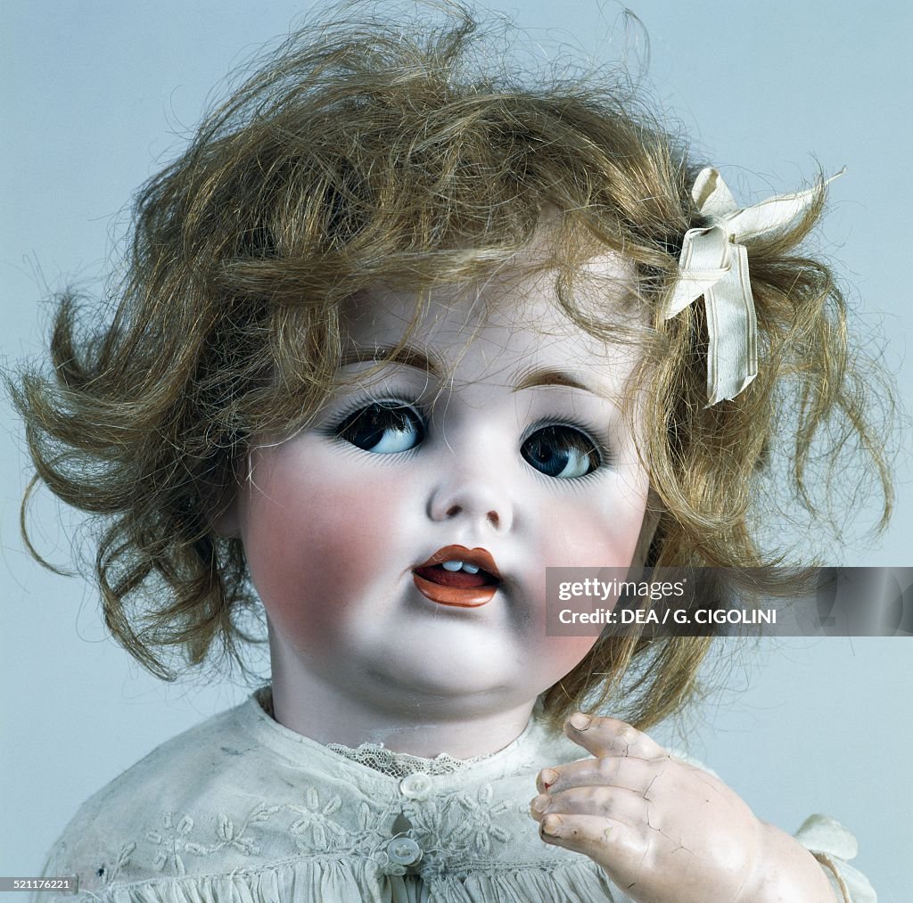 Baby doll No 257 with bow in her hair...