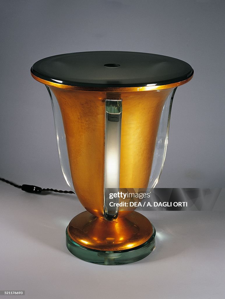 Glass and copper-plated brass table lamp...