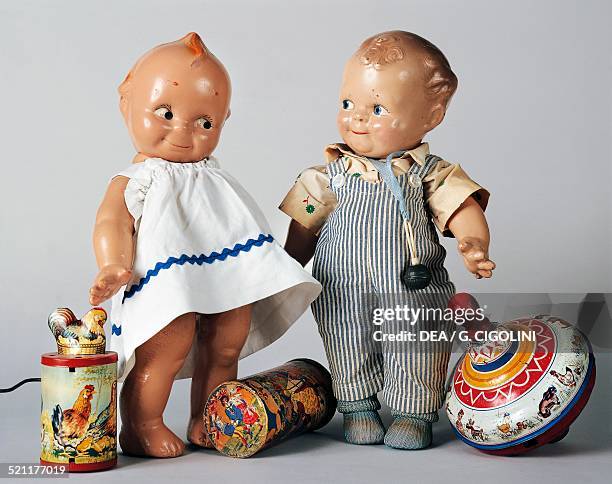 Celluloid Kewpie dolls with toys, ca 1925s-1930s. United States of America, 20th century. United States