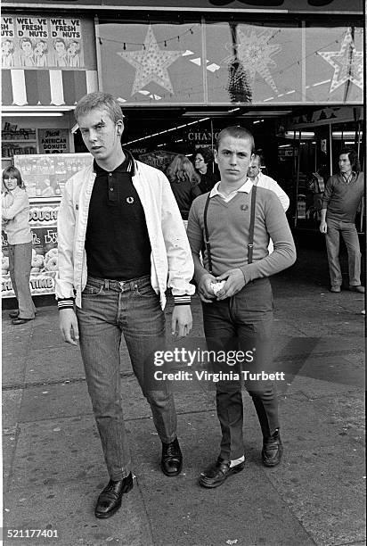 Two mod styled skinheads wearing Fred Perry shirts, loafers and braces on the seafront in Southend, United Kingdom, 27 August 1979.