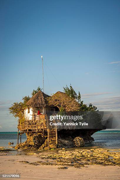the rock restaurant on zanzibar island - island hut stock pictures, royalty-free photos & images