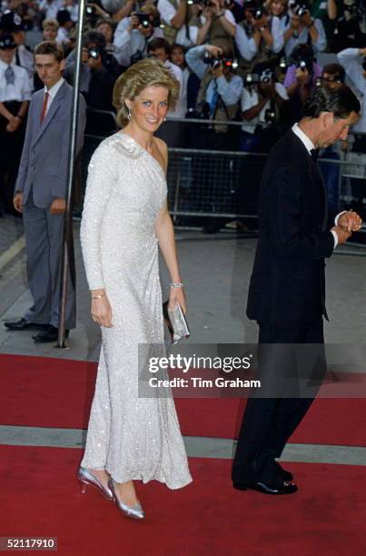 Princess Diana Attending The Film Premiere Of The James Bond Film 'a Licence To Kill.' She is wearing a white, crystal-beaded silk chiffon assymetric...