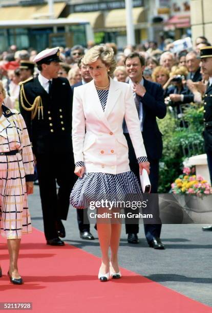 Princess Diana Arriving At The Cannes Film Festival In France Wearing A Puff-ball Skirt.