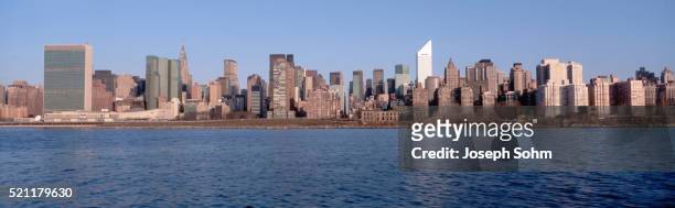 east river and new york skyline - east river stock pictures, royalty-free photos & images