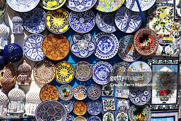 handmade ceramic plates on display - sidi bou said fotografías e imágenes de stock