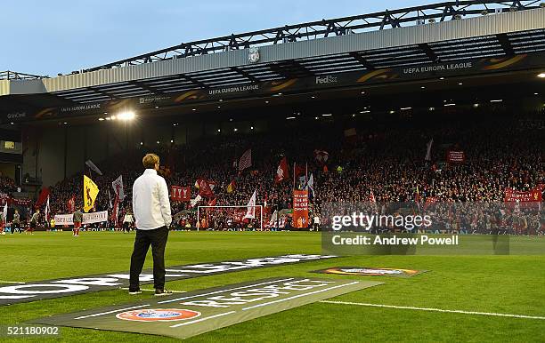 Jurgen Klopp manager of Liverpool watches the Kop stand before the UEFA Europa League Quarter Final: Second Leg match between Liverpool and Borussia...