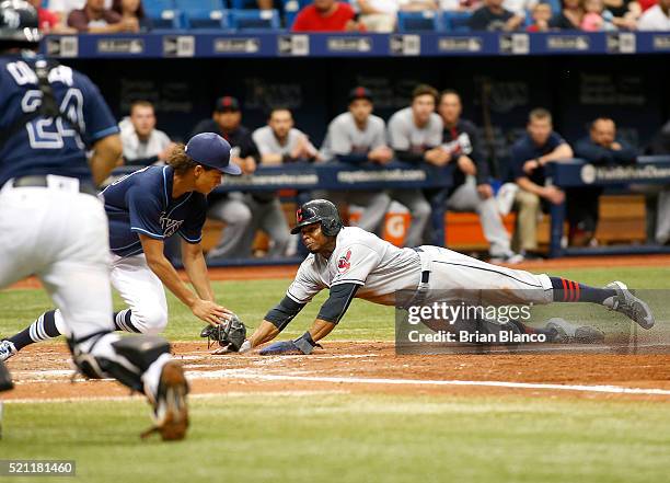 Pitcher Chris Archer of the Tampa Bay Rays gets the out at home plate on Rajai Davis of the Cleveland Indians during the fifth inning of a game on...