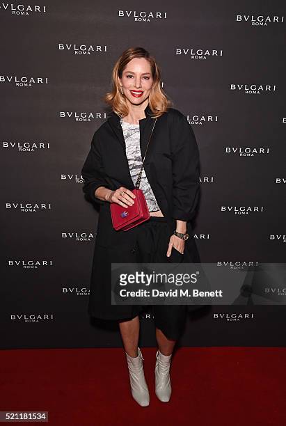 Sienna Guillory, carrying a Bulgari bag, arrives at the Bulgari flagship store reopening on New Bond Street on April 14, 2016 in London, England.