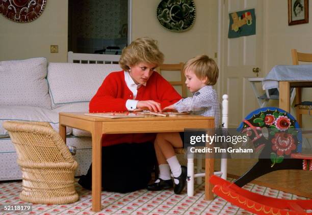 Diana Princess Of Wales Helping Her Son, Prince William, With A Puzzle At Home In The Playroom Of Kensington Palace