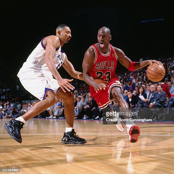 Michael Jordan of the Chicago Bulls drives against Juwan Howard of the Washington Bullets at the MCI Center on April 3, 1997 in Washington, DC. NOTE...