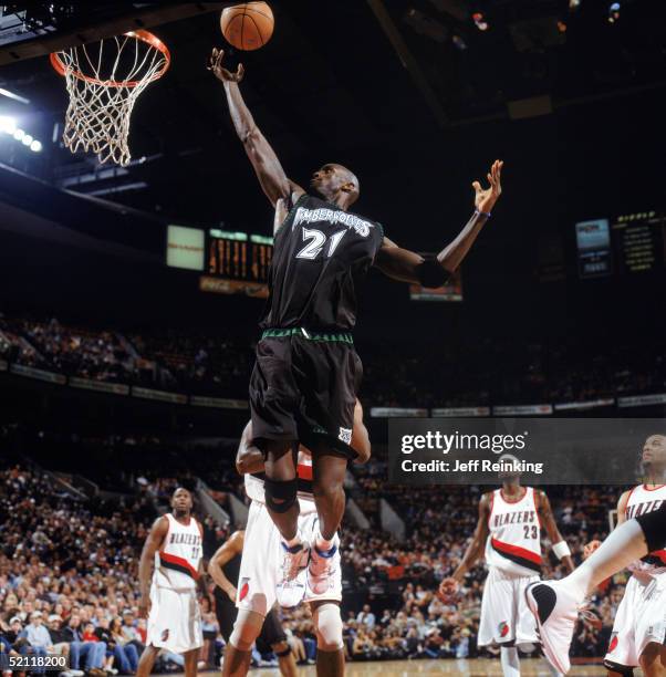 Kevin Garnett of the Minnesota Timberwolves lays up a shot during a game against the Portland Trail Blazers at The Rose Garden on January 22, 2005 in...