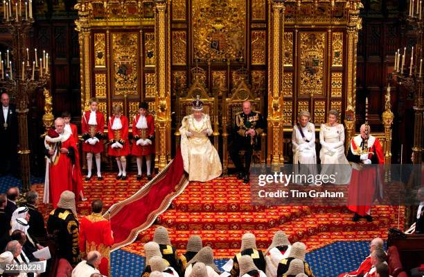 The Queen, With Prince Philip Sitting Beside Her, Reading Her Speech To The House Of Lords At The State Opening Of Parliament In London. To The Left...