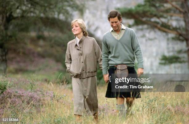 Prince Charles Holding Princess Diana's Hand During Their Honeymoon At Balmoral In Scotland.the Princess Is Wearing A Suit Designed By Bill Pashley...