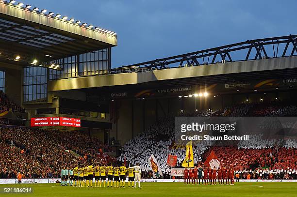 The team's stand for a minute's silence during the UEFA Europa League quarter final, second leg match between Liverpool and Borussia Dortmund at...