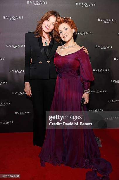 Carla Bruni, wearing Bulgari jewellery, and Carmen Giannattasio, wearing Bulgari jewellery, arrive at the Bulgari flagship store reopening on New...