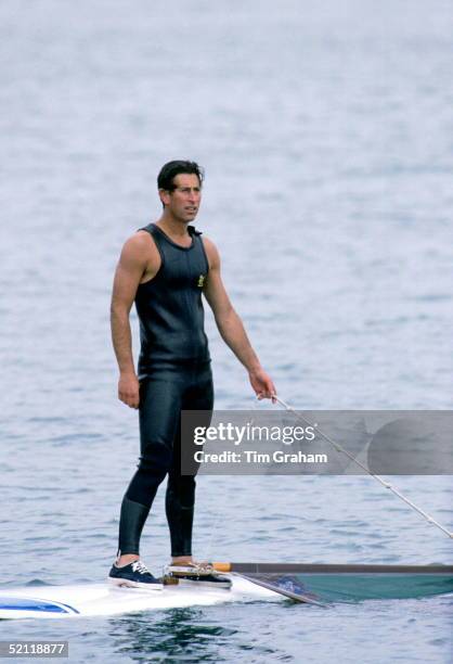 Prince Charles Windsurfing At Cowes. He Is Standing On His Board Watching Prince Edward On 5th Or 6th August