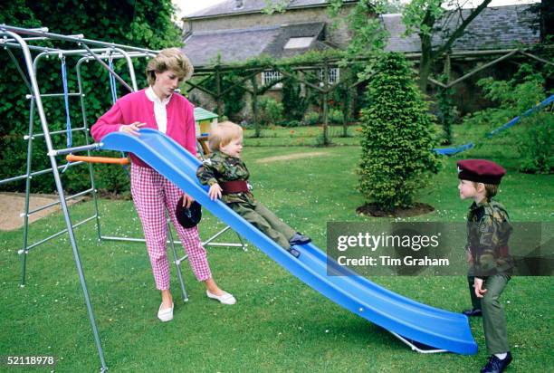 Princess Diana At Highgrove With Prince William And Prince Harry Dressed In Miniature Parachute Regiment Uniforms And Playing On Their Slide In The...