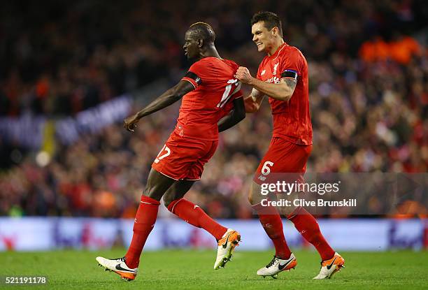 Mamadou Sakho of Liverpool celebrates scoring his team's third goal with Dejan Lovren during the UEFA Europa League quarter final, second leg match...