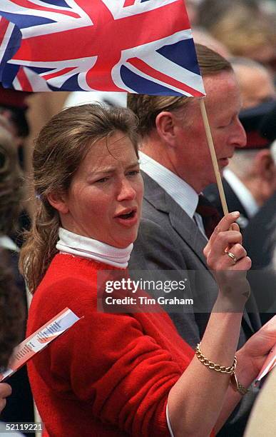 Tiggy Legge-bourke Joins The Crowd At Buckingham Palace Waving A Union Jack Flag To Commemorate Ve Day.