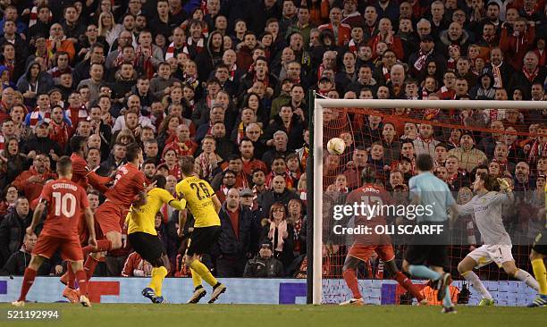 Liverpool's Croatian defender Dejan Lovren scores the winning goal during the UEFA Europa league quarter-final second leg football match between...
