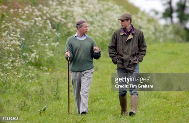 Prince William, In Countryman Outfit Of Tweed Cap And Waxed Jacket And With His Hands In His Pockets, Visits Duchy Home Farm With Prince Charles Who...