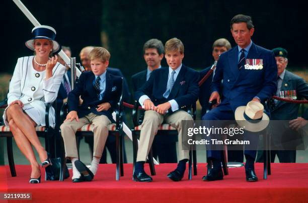 Prince Harry Has Kicked Off His Shoes Whilst Watching The Vj Day 50th Anniversary Parade. He Is Sitting With His Family - Diana, Princess Of Wales,...