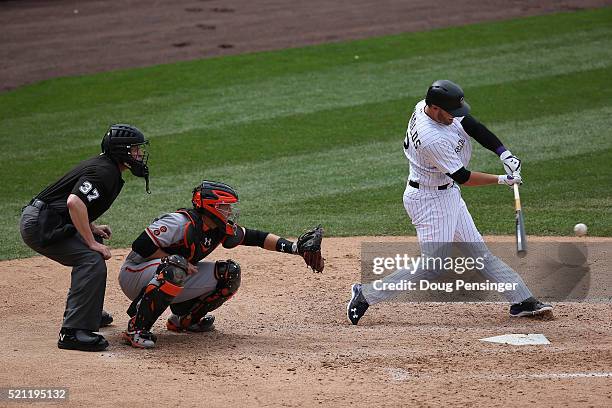 Mark Reynolds of the Colorado Rockies hits a three RBI double off of Chris Heston of the San Francisco Giants to take a 8-1 lead as catcher Buster...