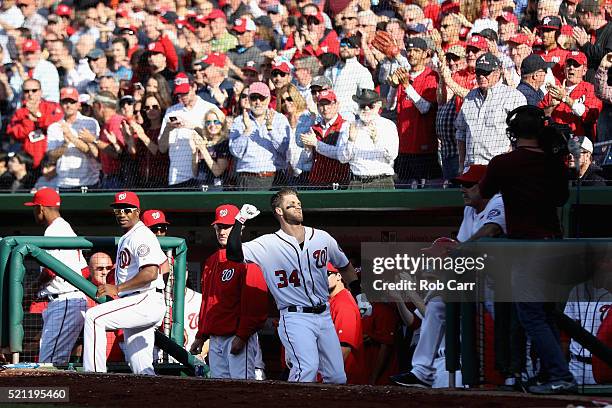 Bryce Harper of the Washington Nationals acknowledges the crowd after hitting a third inning grand slam against the Atlanta Braves at Nationals Park...