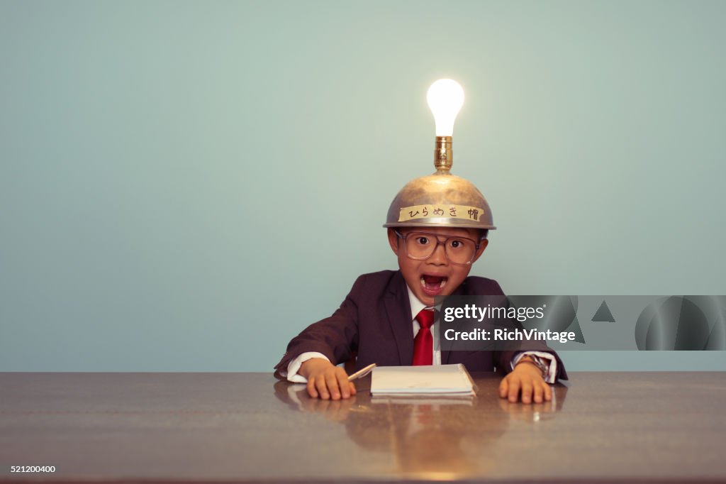 Surprised Japanese Business Boy Wearing Lit Up Thinking Cap