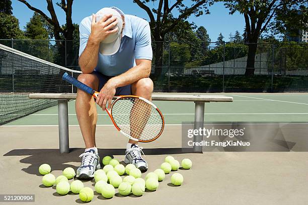 tennis player with his head in his hands - offense sporting position stock pictures, royalty-free photos & images