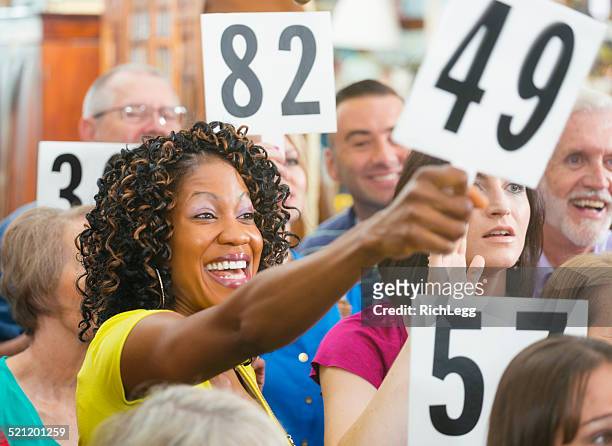 auction crowd - auction stock pictures, royalty-free photos & images