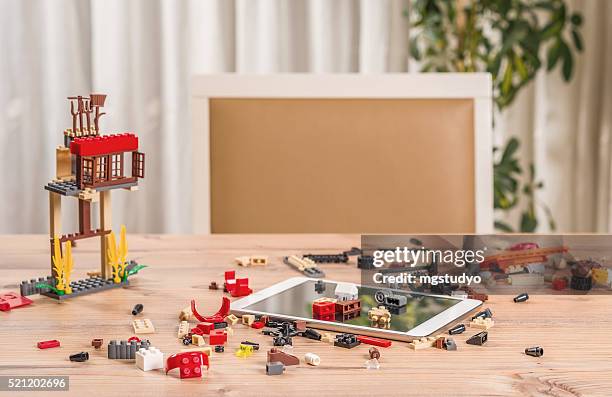 eco farm lego toys and dıgıtal tablet on the table - plastic block stock pictures, royalty-free photos & images