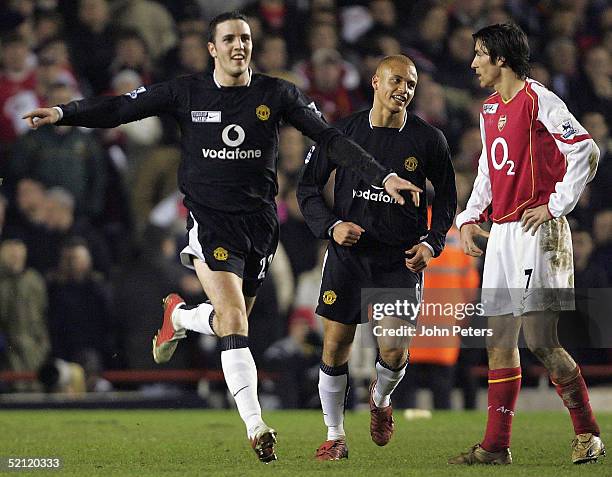 John O'Shea of Manchester United celebrates scoring their fourth goal during the Barclays Premiership match between Arsenal and Manchester United at...