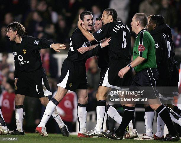 John O'Shea of Manchester United is congratulated by team mates after scoring the fourth goal for United, during the Barclays Premiership match...