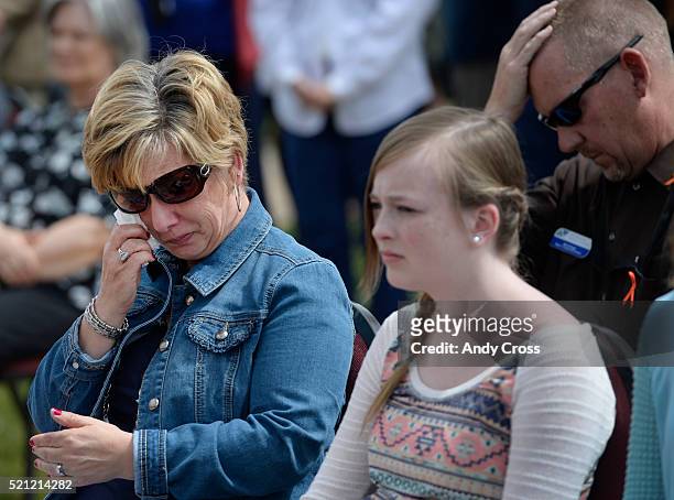 April 14: Denise Morris wipes away tears during the Colorado Department of Transportation Remembrance Day at CDOT headquarters April 14, 2016. Her...
