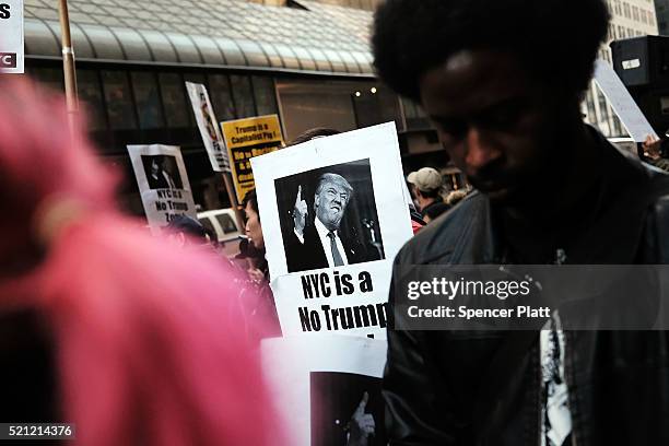 Dozens of protesters and activists gather outside of a midtown hotel which is hoisting a black-tie fund-raiser for the state Republican Party on...