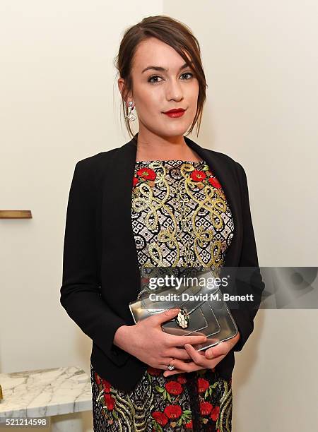 Ella Catliff, carrying a Bulgari Serpenti Forever bag, attends the Bulgari flagship store reopening on New Bond Street on April 14, 2016 in London,...