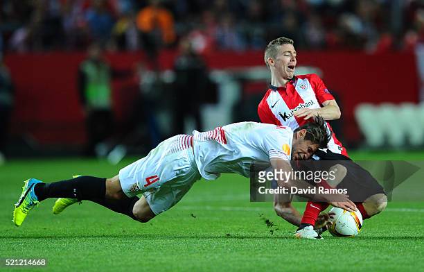 Grzegorz Krychowiak of Sevilla collides with Iker Muniain of Athletic Club Bilbao during the UEFA Europa League quarter final, second leg match...