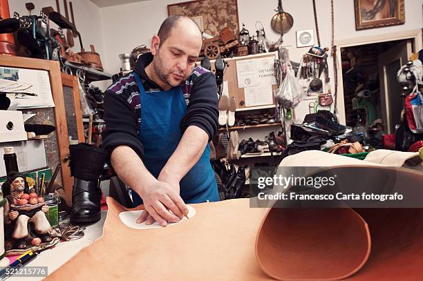 Bootmaker Cutting High-Res Stock Photo - Getty Images