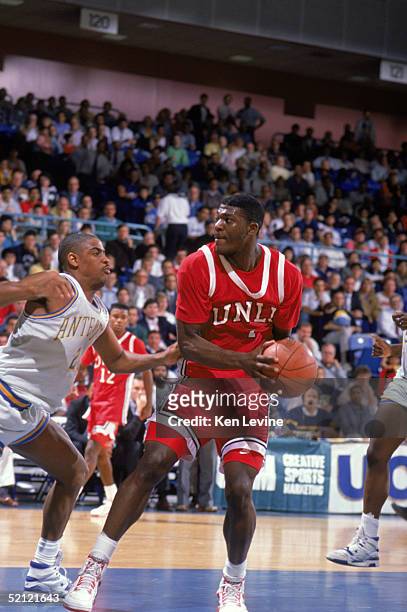 Larry Johnson of the University of Las Vegas Nevada Rebels looks to move the ball during an NCAA game against UC Irvine Anteaters in 1990.