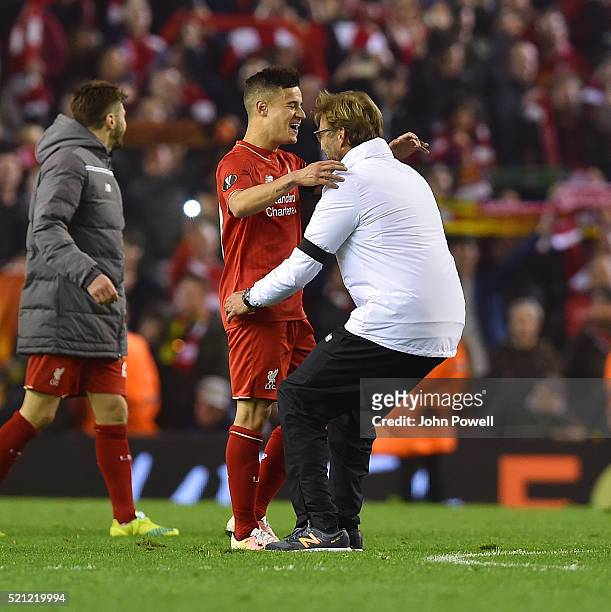 Jurgen Klopp manager of Liverpool embraces Philippe Coutinho of Liverpool at the end of the UEFA Europa League Quarter Final: Second Leg match...