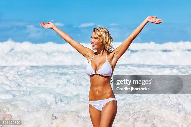 sexy young carefree woman on hawaiian beach wearing white bikini - hot female models stock pictures, royalty-free photos & images