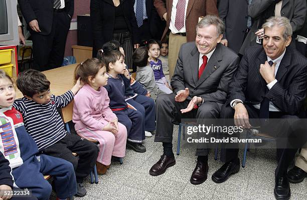 German President Horst Koehler applauds as young Jewish kindergarten children welcome him and local mayor Eli Moyal looks on, on February 2, 2005 in...