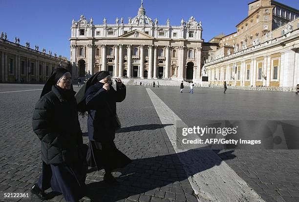 Nuns walk on St-Peter's square at the Vatican, 02 February 2005. Pope John Paul II was in a stable condition in Rome's Gemelli hospital, and was...