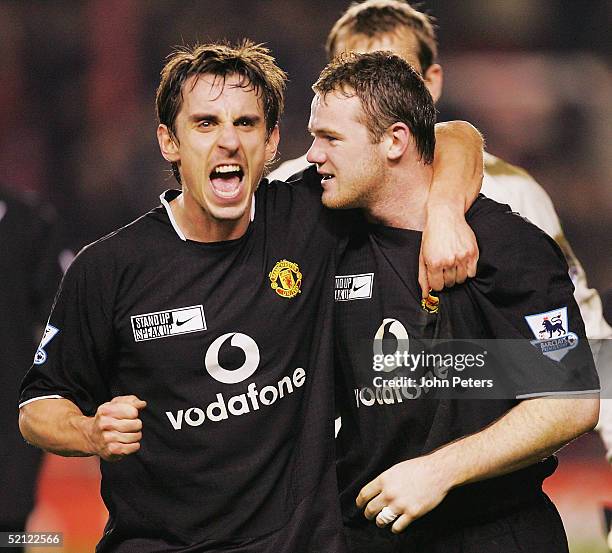 Gary Neville and Wayne Rooney of Manchester United celebrate after the Barclays Premiership match between Arsenal and Manchester United at Highbury...