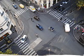 Four road junction with cars in Paris