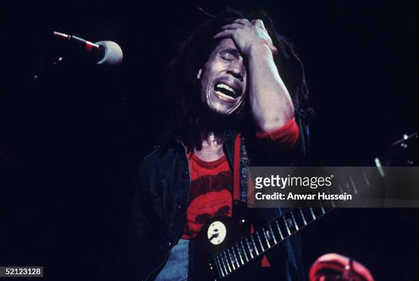Jamaican reggae legend Bob Marley performs live on stage in June 1977 at the Hammersmith Odeon, London, England.