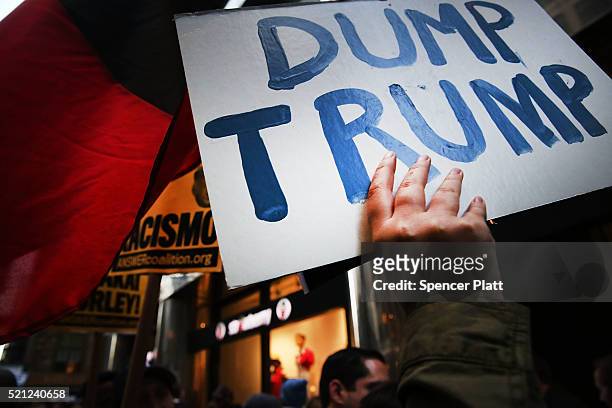 Hundreds of protesters and activists march during a demonstration near a midtown hotel which is hosting a black-tie fund-raiser for the state...