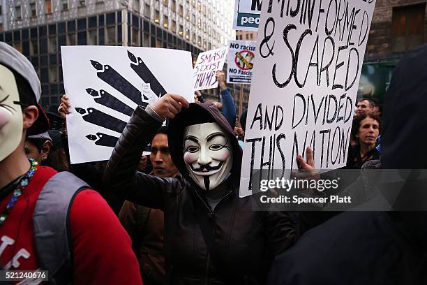 Hundreds of protesters and activists march during a demonstration near a midtown hotel which is hosting a black-tie fund-raiser for the state...